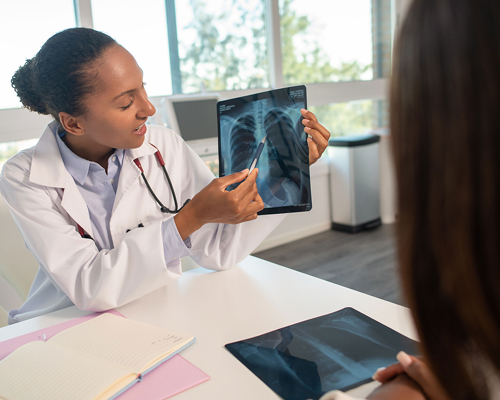 Provider showing lung x-ray